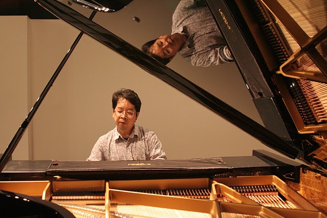 That's Tetsuya, enjoying the sound of a FAZIOLI's piano; June 2011